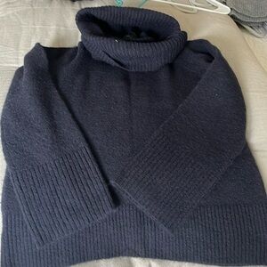Large turtleneck sweater with bell sleeves. And Taylor size large.